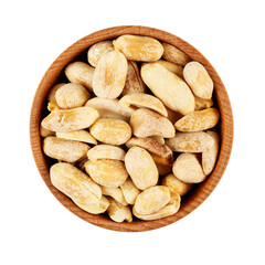 Peanuts, roasted and salted, in wooden bowl isolated on white background. Shelled Arachis hypogaea, also called groundnut and goober, used as a snack. File contains clipping path.