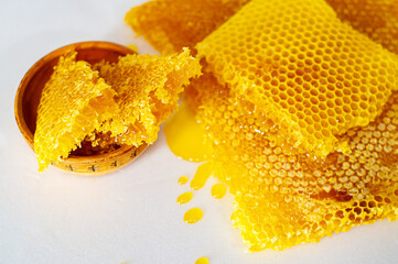 Honeycomb on a white background and in a clay plate