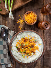 Cream of potato soup with bacon, cheese and green onions