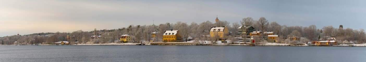 Panorama, the ness Blockhusudden, old houses, café, lighthouse a snowy blech winter day in Stockholm