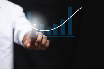 Businessman draw growth graph and progress of business and analyzing financial and investment data