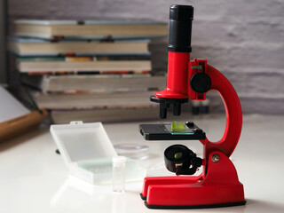 Microscope, laboratory equipment, books. Education concept