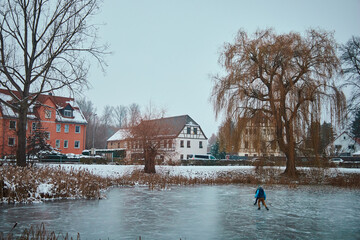 public lake of Leipzig Holzhausen, Saxony Germany, frozen in winter