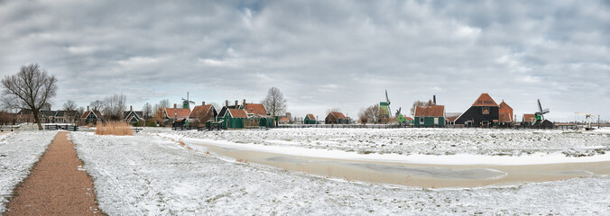 Panorama of the old Dutch village Zaanse Schans in winter, in the Netherlands. - 554673511