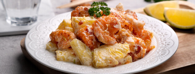 Delicious fried shrimp balls with pineapple and mayonnaise sauce.