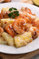 Delicious fried shrimp balls with pineapple and mayonnaise sauce.