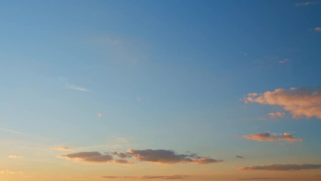 Sunset or dawn backlit by warm sun. Panorama style background. Sunset or dawn sky. Timelapse.