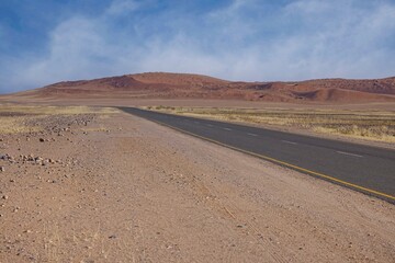 Desert landscape with acacia trees and mountains, NamibRand Nature Reserve, Namib, Namibia, Africa