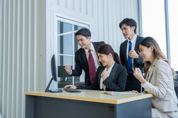 A group of young Asian businessmen Talking and planning work happily and have fun. at the company's office