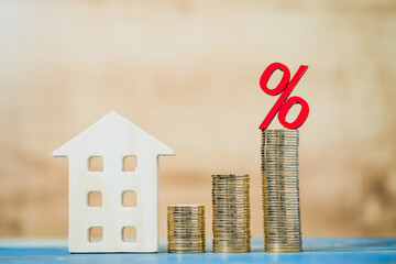 Home model and the stack gold coin with growing value and percent for the appraisal, planning...