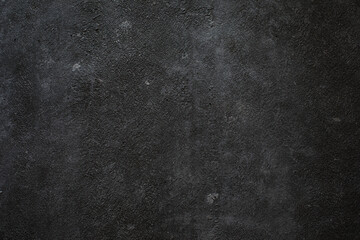 Textured concrete wall with concrete chips