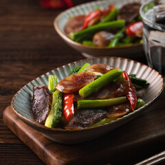 Delicious spicy homemade stir-fried Chinese smoked sausage with asparagus.