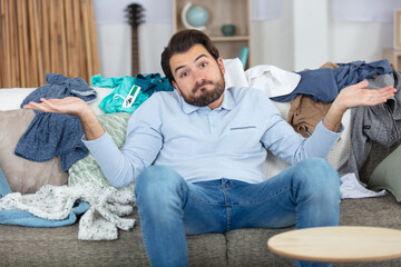 young man not happy to do the laundry