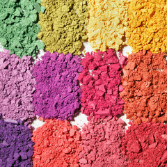 Set colorful swatches beauty product multi-colored crushed eyeshadows for makeup isolated on white background, flat lay of eyeshadows vivid colors, close up cosmetic textures, top view pattern