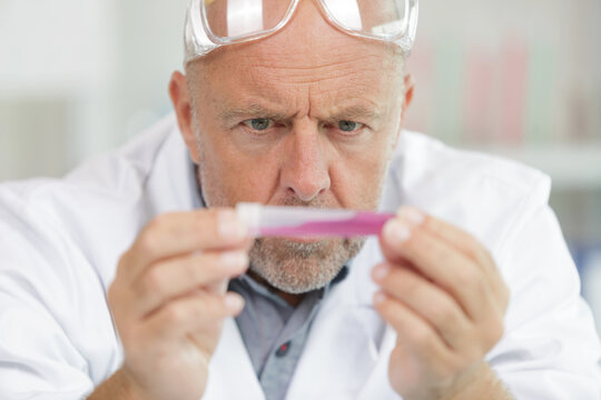 senior male researcher carrying out scientific research