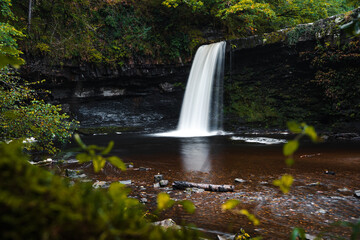 Fototapeta na wymiar Sgwd Gwladys or Lady Falls along the Four Waterfalls walk, Waterfall Country, Brecon Beacons national park, South Wales, the United Kingdom. Long exposure.