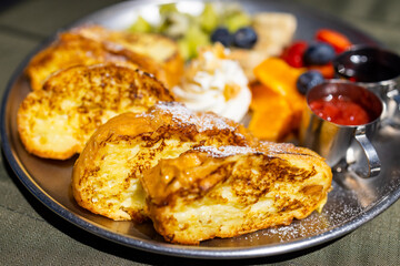 Grill toast with egg and fruit in coffee shop