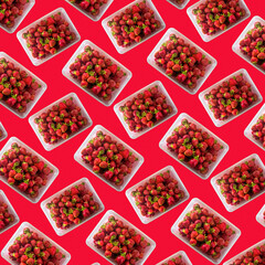 seamless pattern from a bowl with fresh strawberries and a red background