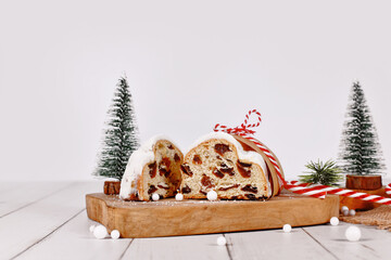 Cut open German Stollen cake, a fruit bread with nuts, spices, and dried fruits with powdered sugar...