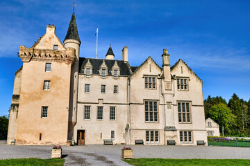 Fototapeta na wymiar Acres of gentle Moray countryside surround the rose-coloured Brodie Castle, ancestral home of the Brodie clan for over 400 years, although their family seat has been here since the 12th century.