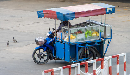  A fresh fruit seller drive a mobile shop on the street, Thailand