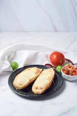 Molletes, typical Mexican food on a white marble table