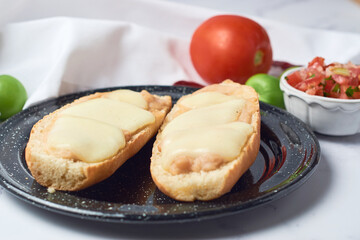 Mexican molletes on a white marble table