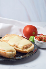 Authentic and traditional mexican molletes on a white marble table