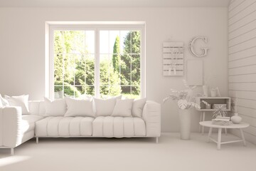 Fototapeta premium Mock up of stylish room in white color with sofa and green landscape in window. Scandinavian interior design. 3D illustration