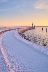 Walkway at the Nordermole Travemunde in winter. High quality photo