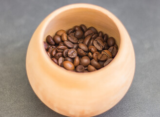 Coffee beans in clay bowl. Brown roasted coffee. Caffeine beverage. Coffee shop. Aroma drinks. Coffee beans in sunlight. Morning drinks. Arabica mug. Aromatic breakfast. 
