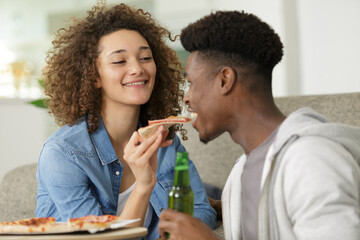 giving boyfriend a pizza bite