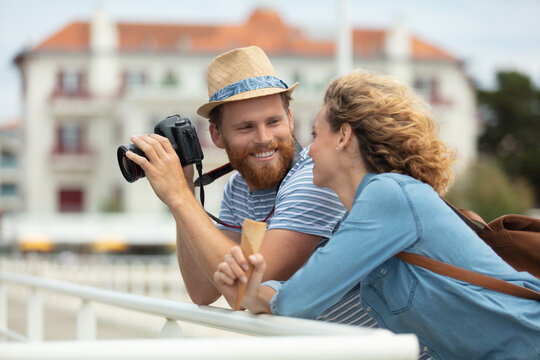 tourist couple taking photo on the bridge