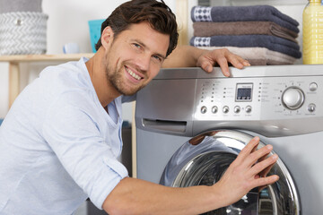 young man doing the laundry