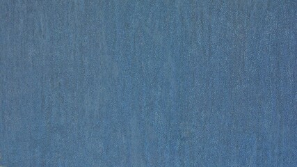 Fototapeta na wymiar Dark blue textured rough paper background