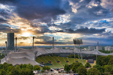 View of the Olympic Stadium in the evening, Munich, Bavaria, Germany outlook, cloud, cloudy, foggy, olympic games, sunshine, overview, on, look, topview, european, up, town, city park, sunset - obrazy, fototapety, plakaty