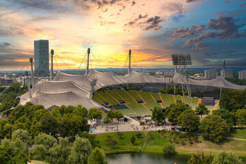 View of the Olympic Stadium in the evening, Munich, Bavaria, Germany outlook, cloud, cloudy, foggy, olympic games, sunshine, overview, on, look, topview, european, up, town, city park, sunset - obrazy, fototapety, plakaty