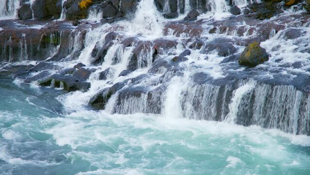 Beautiful Nature Waterfall in Iceland, Pure Turquoise Water in Mountain River, Shot in 8K Resolution 4320p