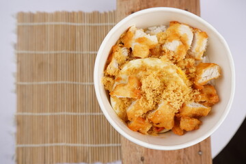Asian food,  a bowl of rice with delicious meat crunchy and savory