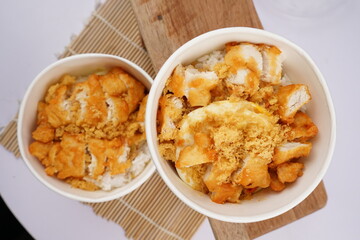 Asian food,  a bowl of rice with delicious meat crunchy and savory