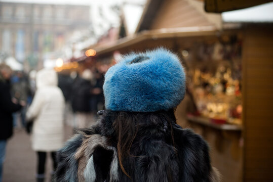 Closeup of young woman wearing a traditional russian hat in the street