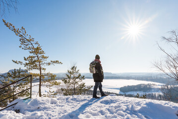 Fototapeta na wymiar person with view at sunny winter scenery
