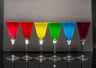 Dark black background with color glass shots
