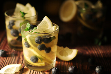 Cold ice tea with lemon and berries