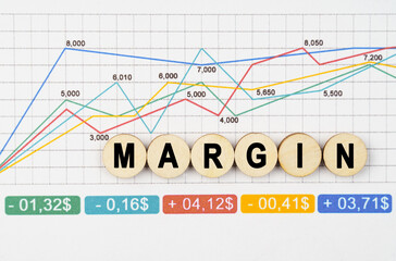 On the financial charts are wooden mugs with the inscription - MARGIN