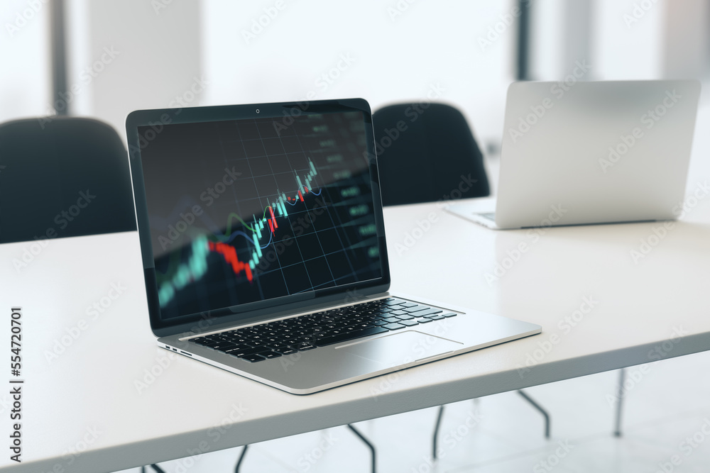 Poster Close up of laptop with forex index chart/graph on screen, placed on desktop and blurry office background. Trade, finance and market concept. 3D Rendering.
