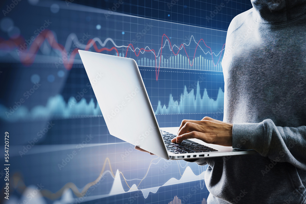 Aufkleber close up of hacker hands using laptop with digital business graph hologram on blurry blue background
