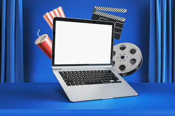 Online cinema movie watching concept with blank white modern laptop screen with place for your logo...