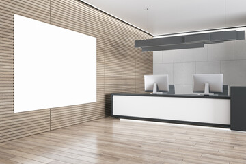 Modern wooden and concrete office reception interior with empty white mock up banner on wall, desk and computer monitors. Hotel lobby and waiting area concept. 3D Rendering.