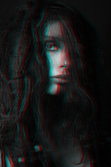 Beautiful woman studio portrait in red and blue color split effect. Model with dreadlocks covering her face with messy hair. Woman with make-up looking at camera. Futuristic looking style